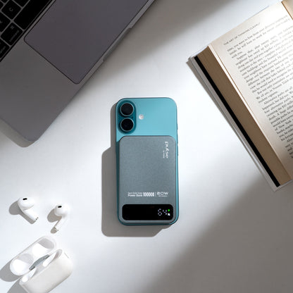 Power Tekne Case 10000mAh 60W battery pack attached to teal iPhone, white AirPods and open book on white desk