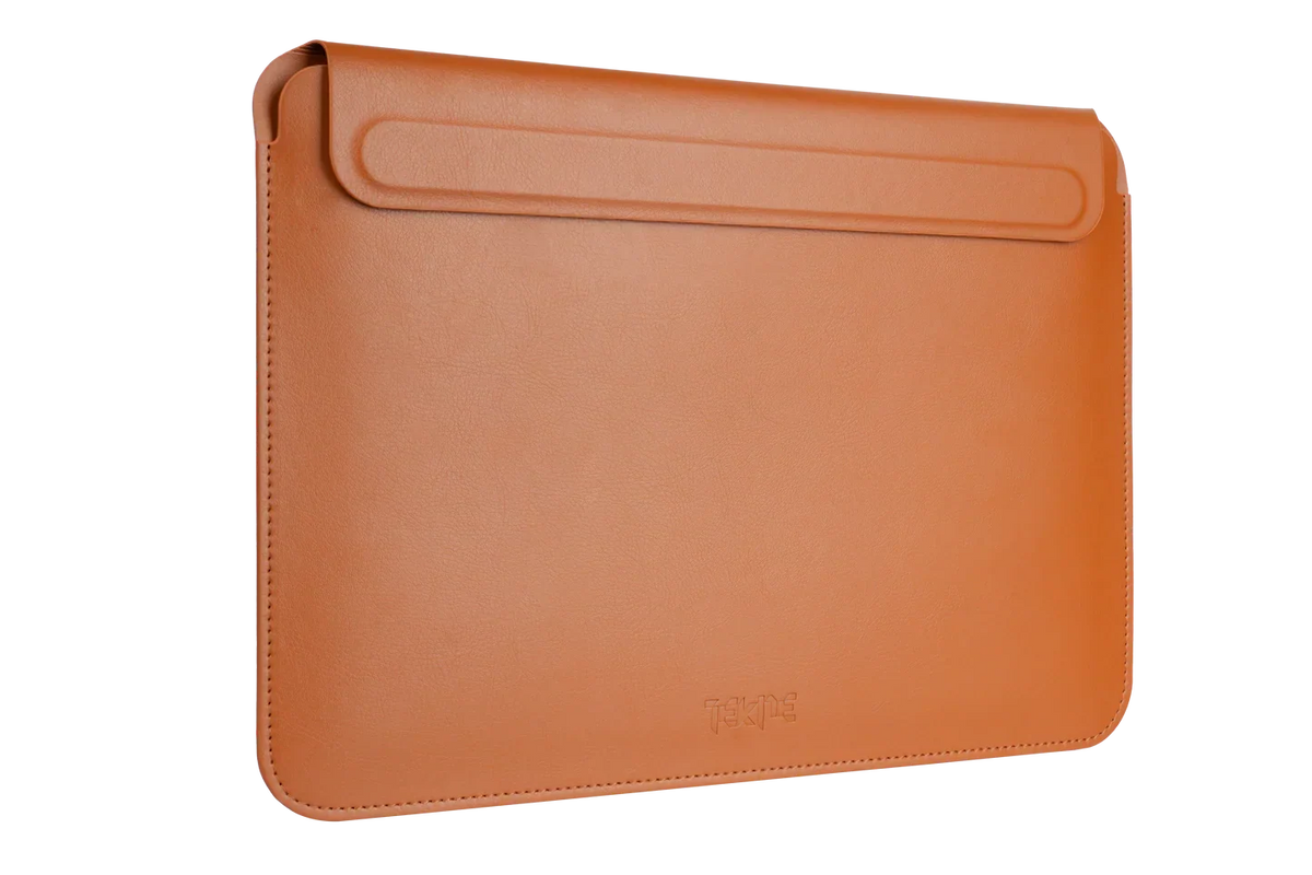 Tan leather Tekne laptop sleeve, front view with a fold-over flap and debossed logo