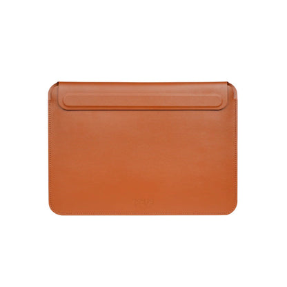 Tan leather Tekne laptop sleeve with top flap closure and visible stitching